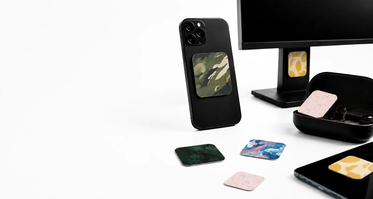 KUVRD cleaning pads on phones, glasses, and a monitor