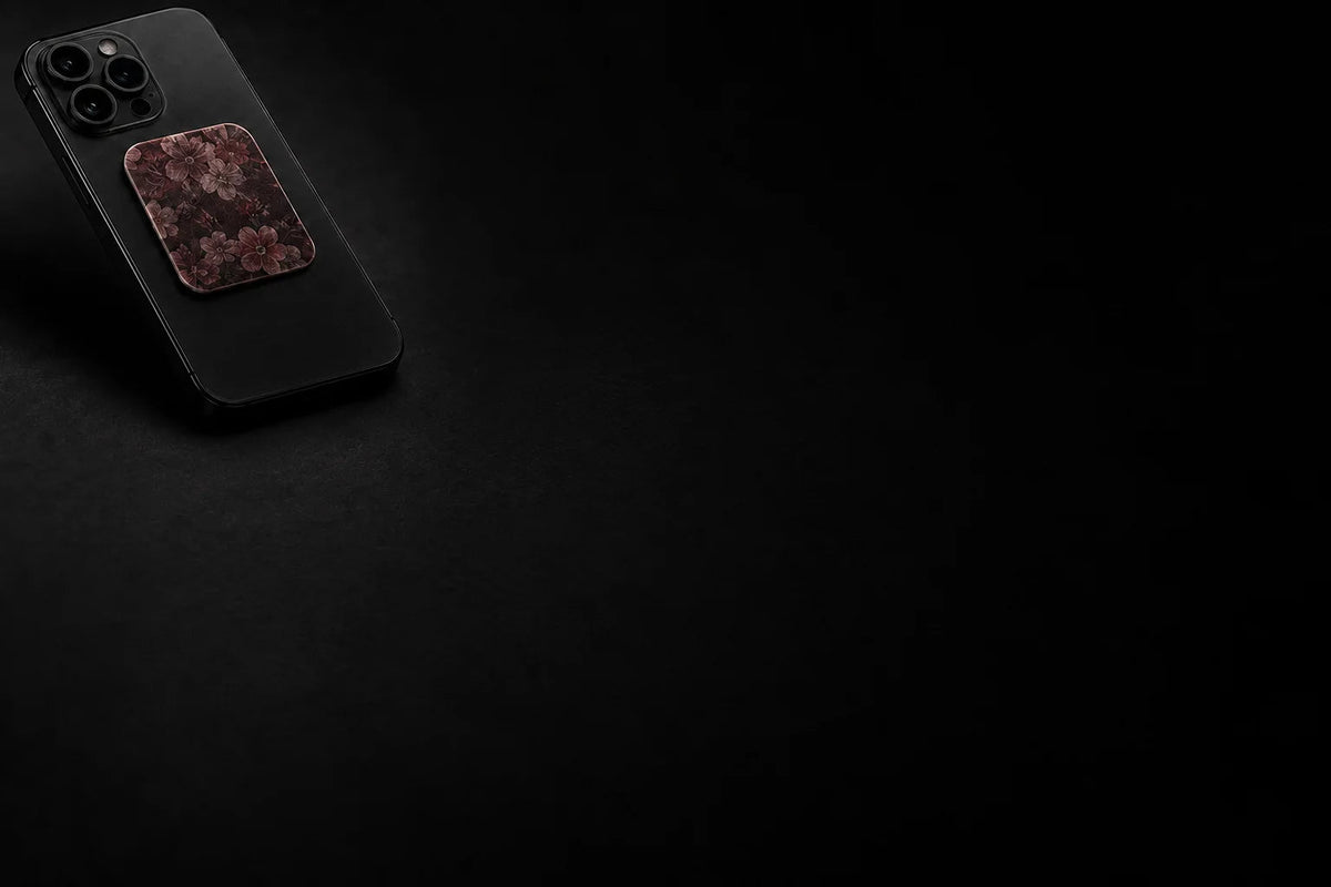 Jiffys cleaning pad attached to a phone on a dark surface
