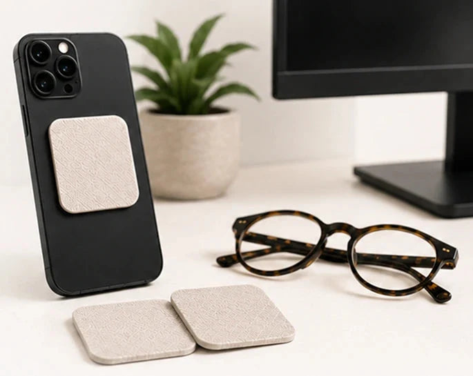 Jiffys cleaning pads with phone, glasses, and desk surfaces